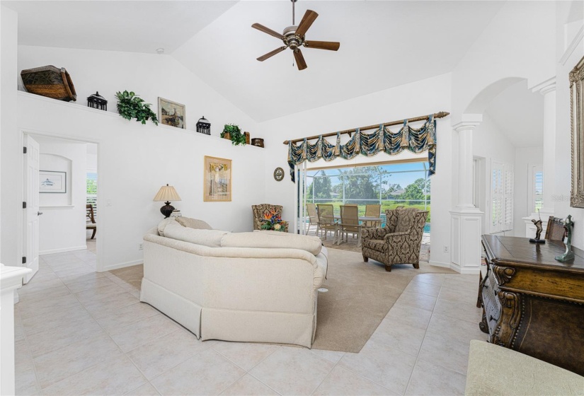 Formal living room has 8' pocket sliding glass doors to the lanai/pool area., providing plenty of light!