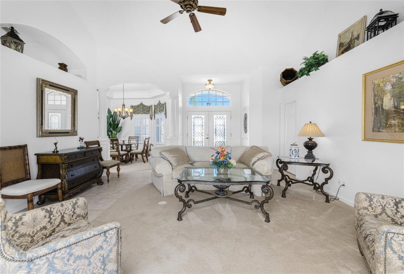 View from living room to front door and dining area.