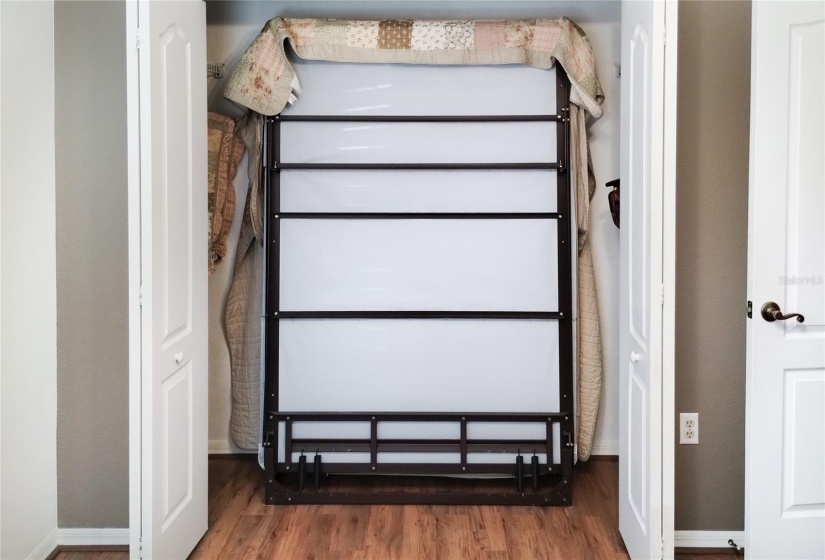 Murphy bed neatly tucks in closet