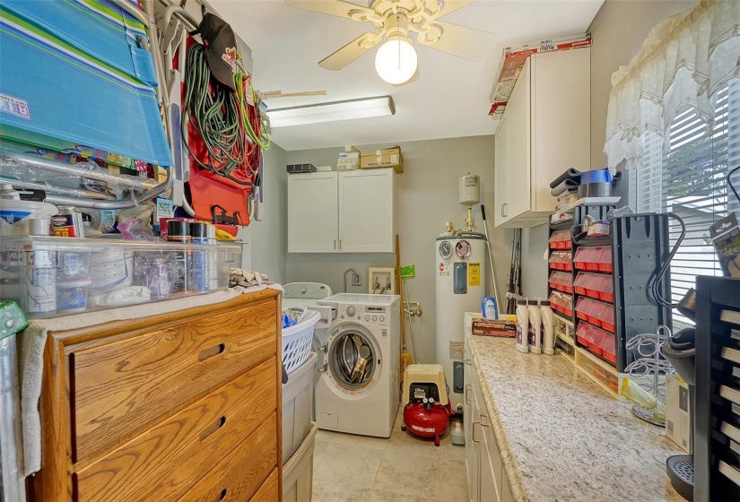 Inside Laundry/Utility room with storage