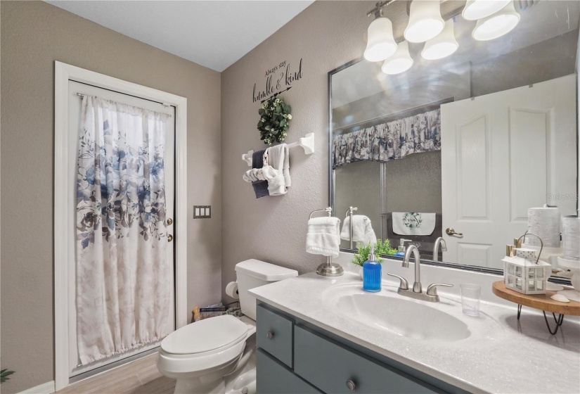 2nd bathroom w/access to the lanai/pool area