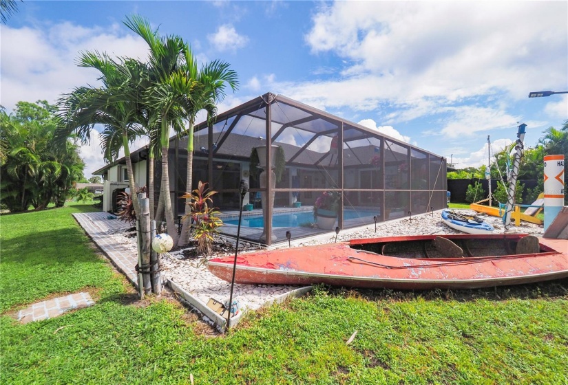 Rear yard behind screened in lanai