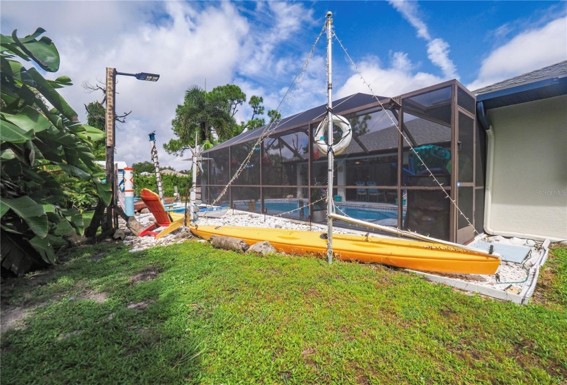 Nicely lighted decorated yard behind your screened in lanai