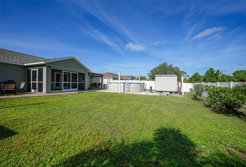 Large backyard with privacy vinyl fencing