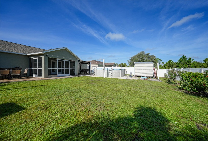 Large fenced back yard with gate entrys on each side