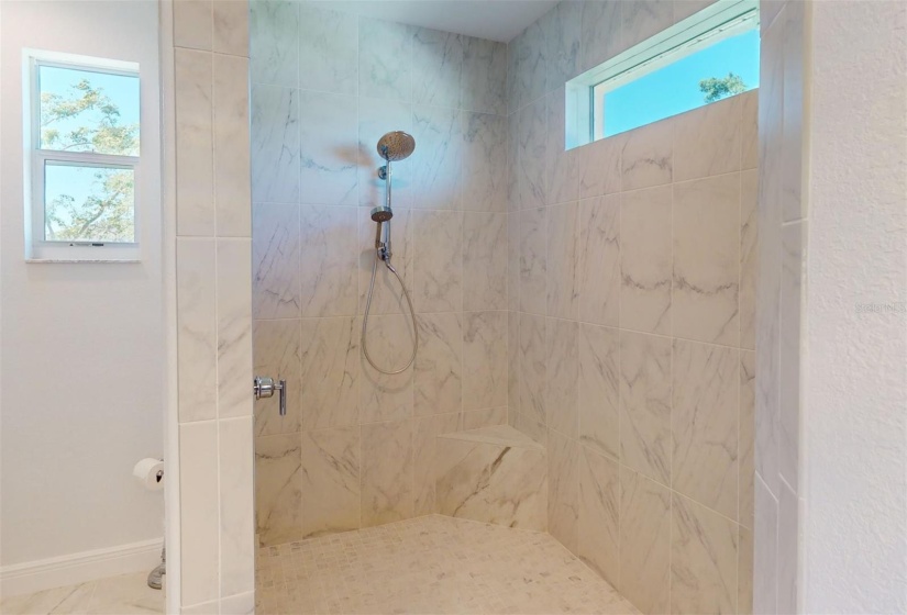 Floor to ceiling tile in large roll in shower