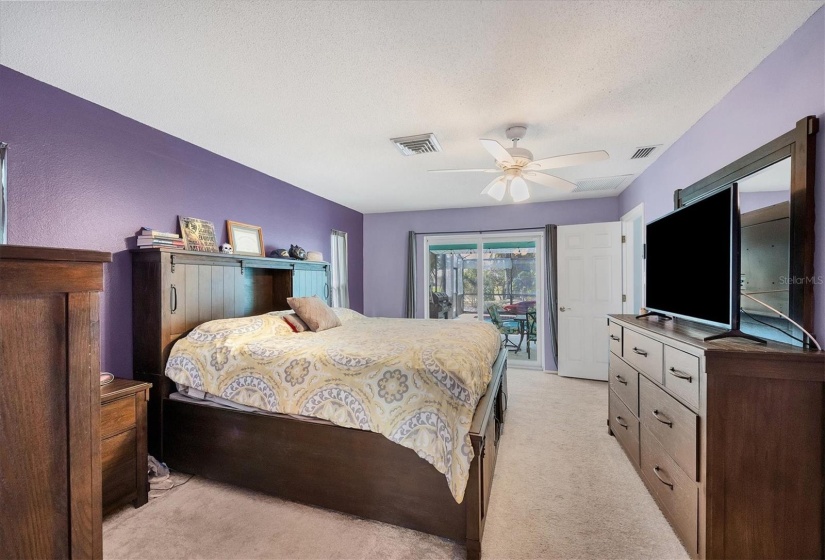 Primary bedroom with impact sliders to the lanai