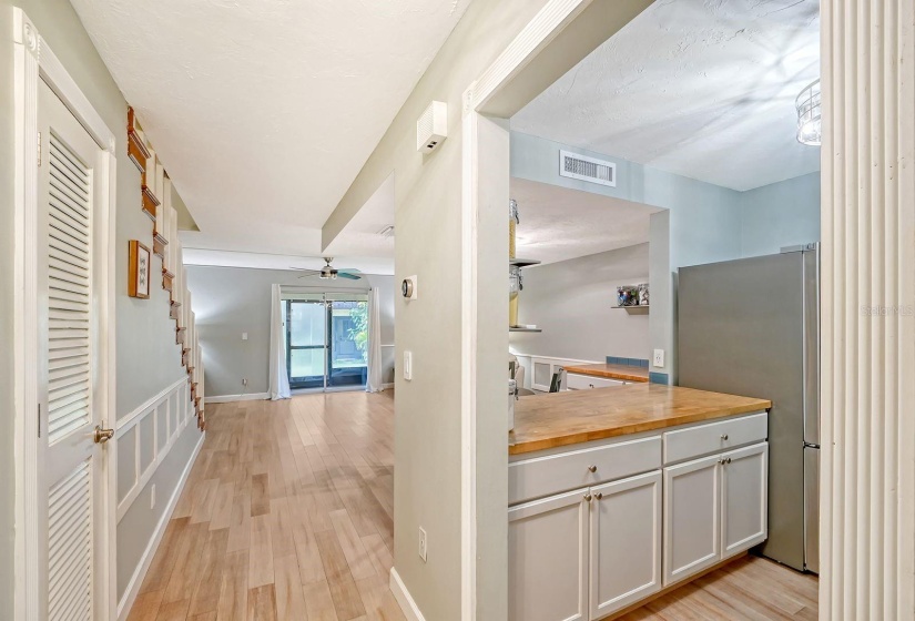 Entrance to the Townhome (1/2 Bath to the Left), Kitchen & Living Rooms