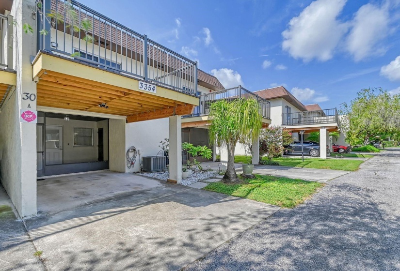 Front Exterior showing the Carport & the Newer Upper Deck