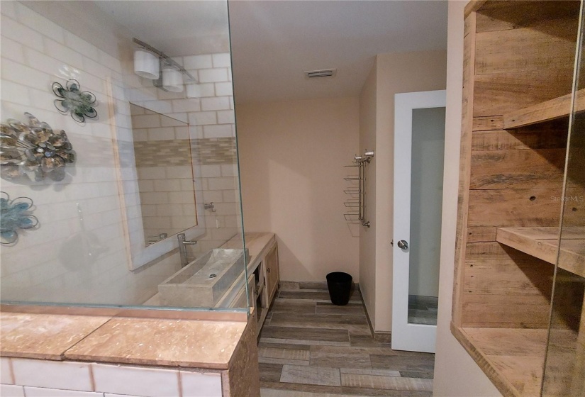 Primary Master bath with glass shower door.