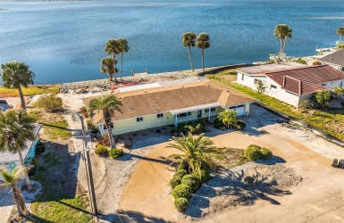 Coastal small town home offers quiet salt life with sweeping southern views !