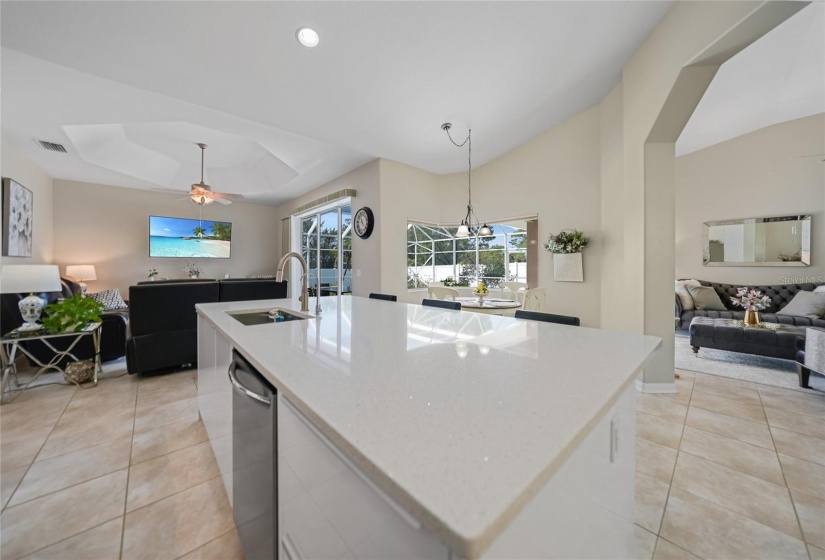 Beautiful large island. Sitting area to the right, dinette area center and family room to left.