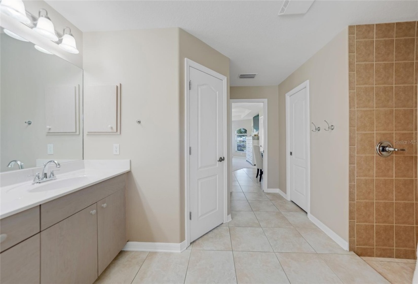 view from primary ensuite looking towards double closets and primary bedroom