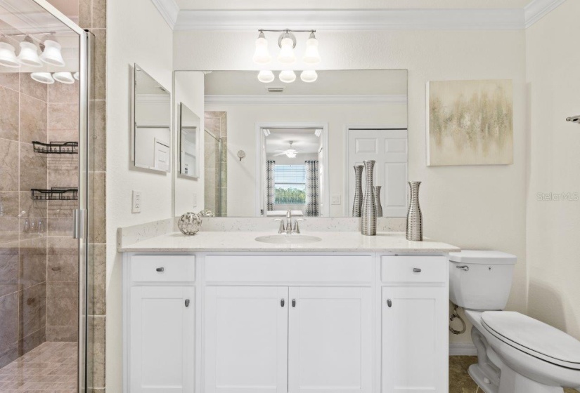 Owners ensuite bathroom featuring a walk-in glass enclosed shower.