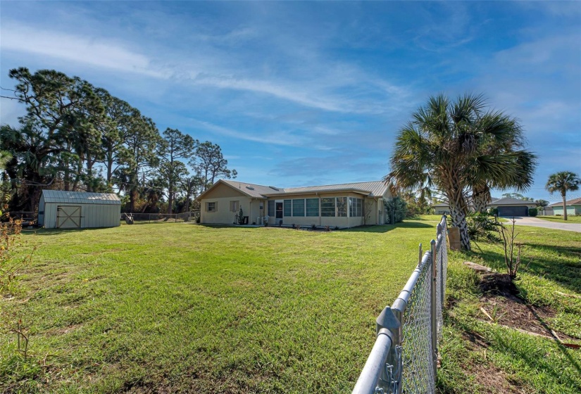 Rear of House, chain-link-fully-fenced lot