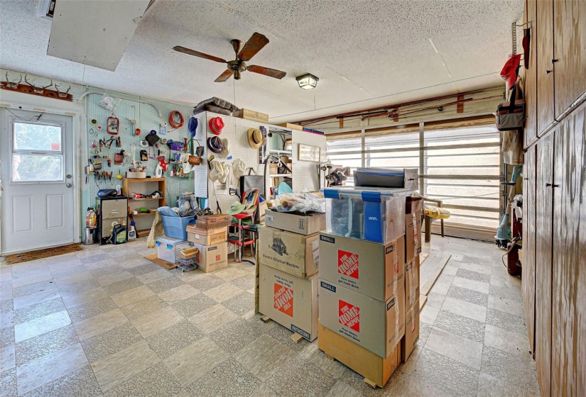 Interior of Garage, with tile flooring, lots of storage