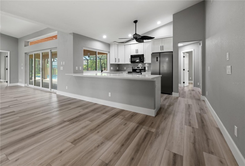 Chef's dream all wrapped up in this kitchen! Solid stone granite counters, white shaker cabinets with black hardware, double door closet pantry and stainless appliances