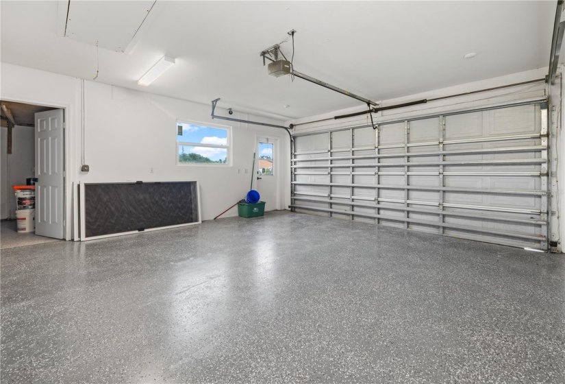 Spacious garage with central vacuum, an enclosed laundry room AND separate workshop