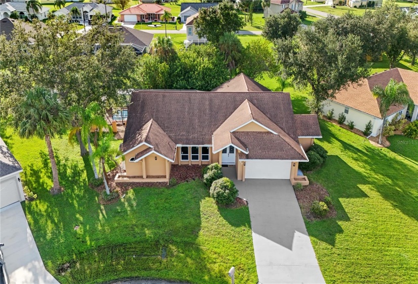 Aerial view of your new pool home is situated on an oversized lot on the cul-de-sac