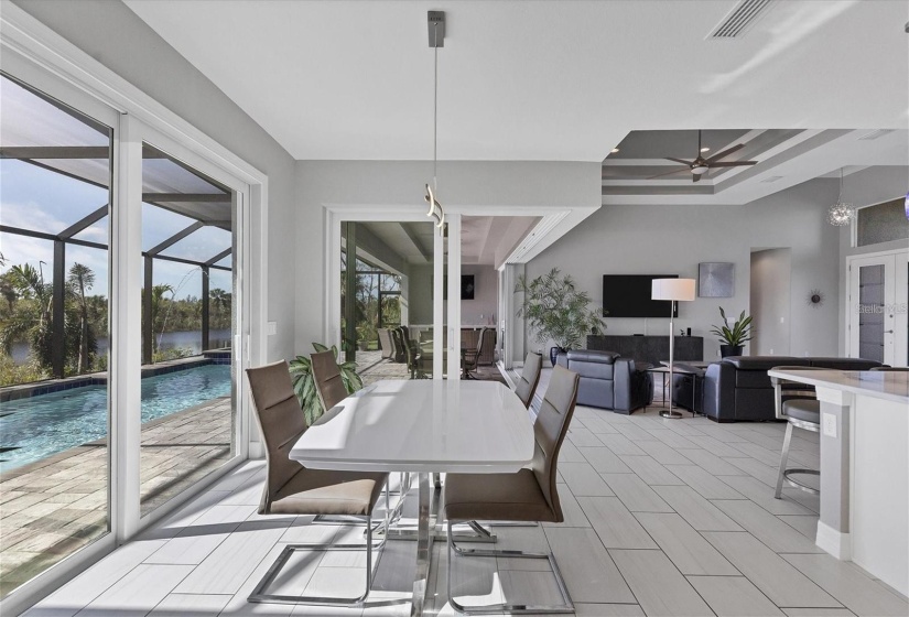 Airy Dinning Room with Large Sliders to Sun deck