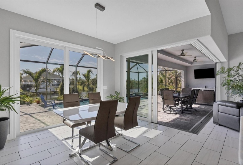 Airy Dinning Room with Large Dual Sliders to Sun Deck