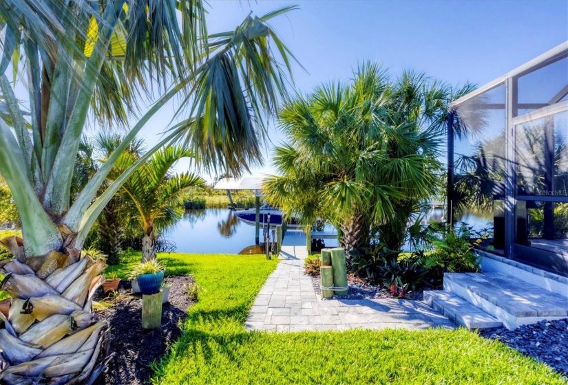 Tropical Oasis with Paver Walkway to Boat Lift