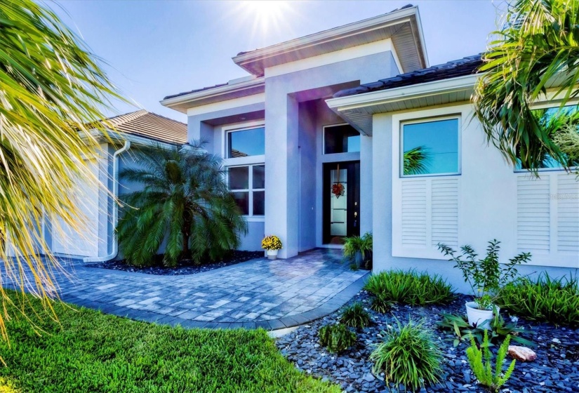 Stunning Front Entry Featuring mature Landscape