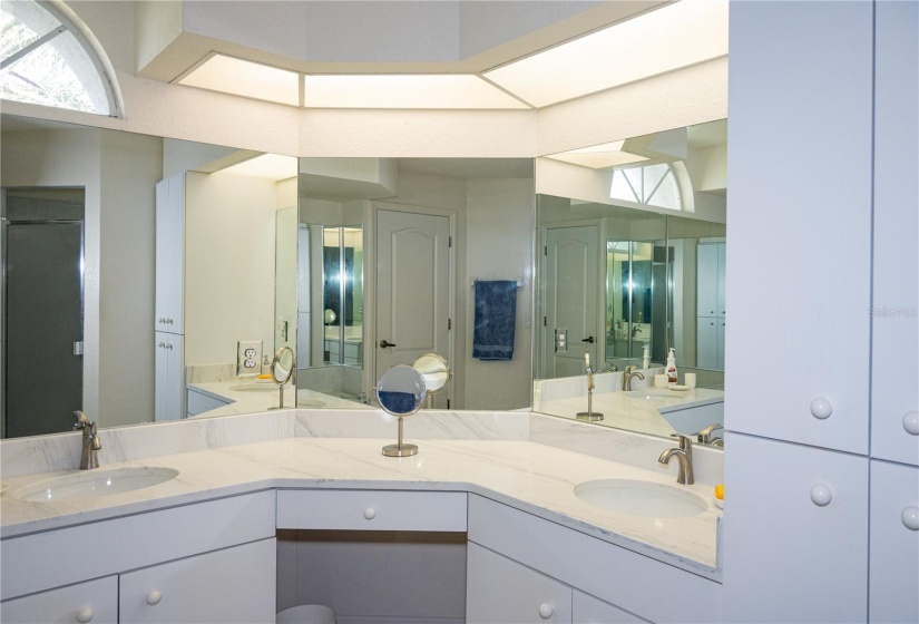 Primary ensuite bathroom with shower, bathtub double vanities and new matching granite counters