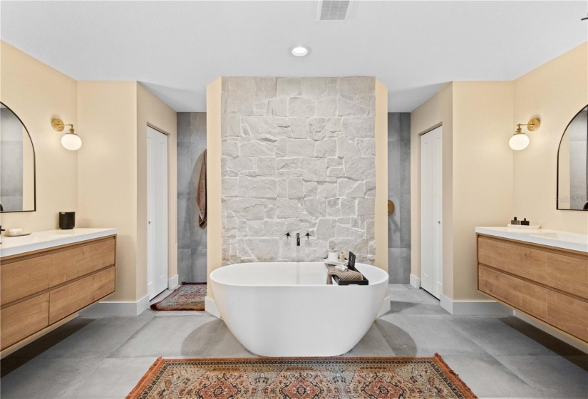 Soaking Freestanding bathtub and double-entry Shower.  Dual Vanity.  Stone Wall and 2 Walk-in Closests