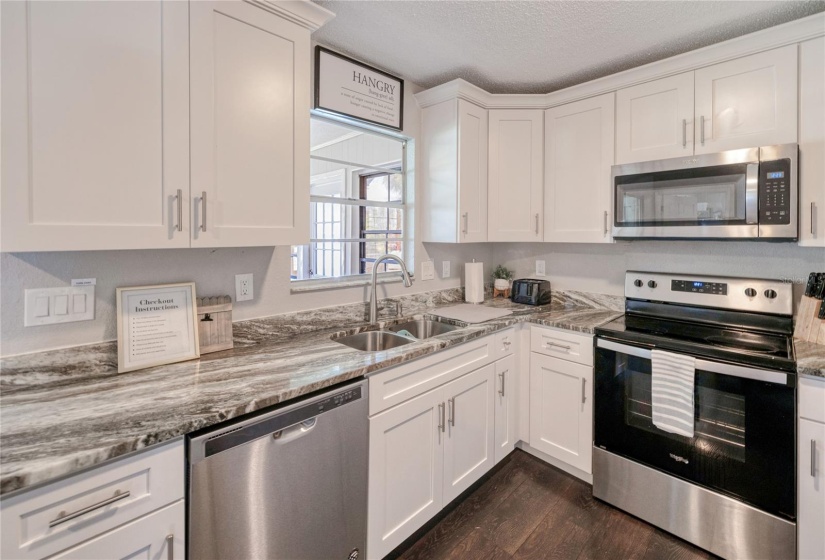 Kitchen with granite and SS appliances