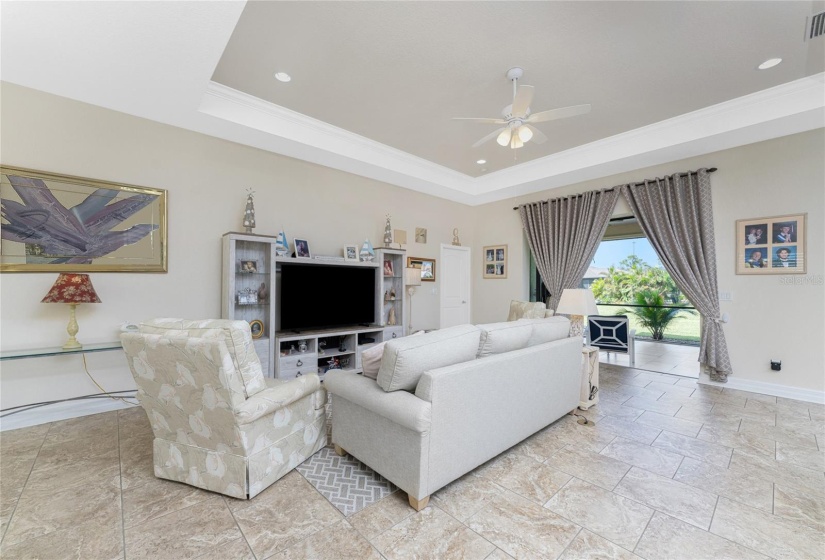 Spacious Great Room with tray ceiling and crown molding