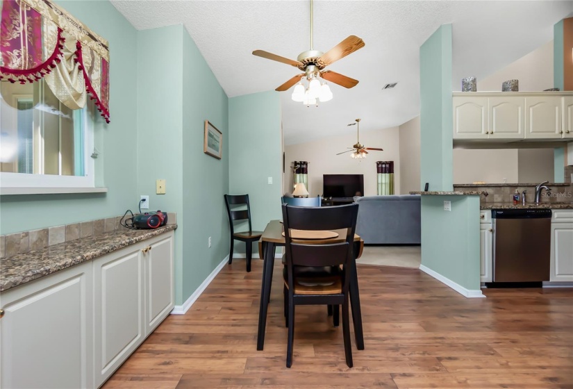 Dinette with sideboard and granite counter.