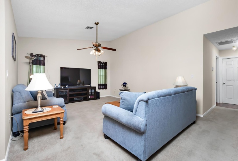 Family room with vaulted ceiling.