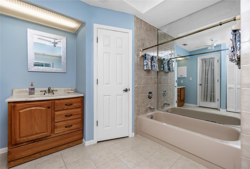 Master bath with water closet behind the door.