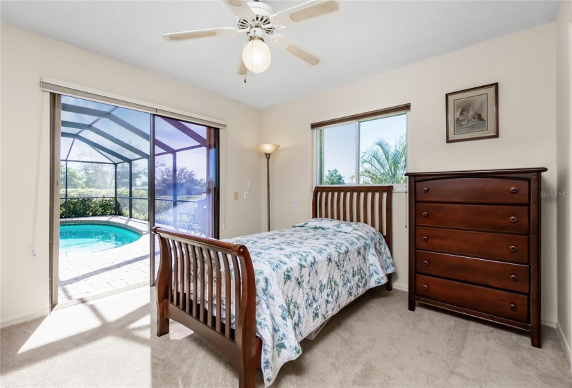 Guest bedroom #2 with direct access to the pool and walk-in closet.