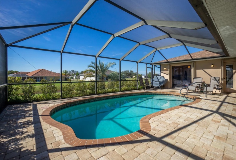 Pool area with paver decking.  Greenbelt between this home and the neighbors you see to the rear in this photo.