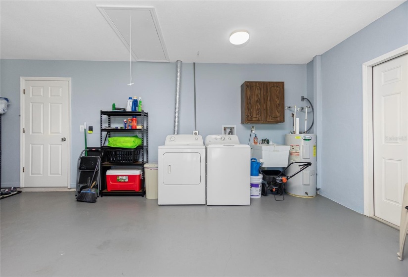 Garage interior.  Rear door leads into the home and the side door, to the right, is the garage service door.