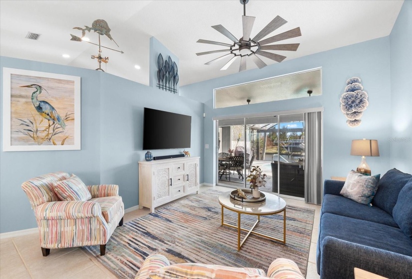 Sophisticated family room with pool views