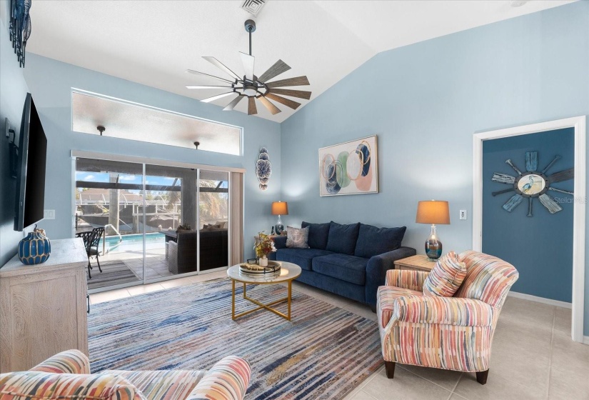 Sophisticated family room with pool views