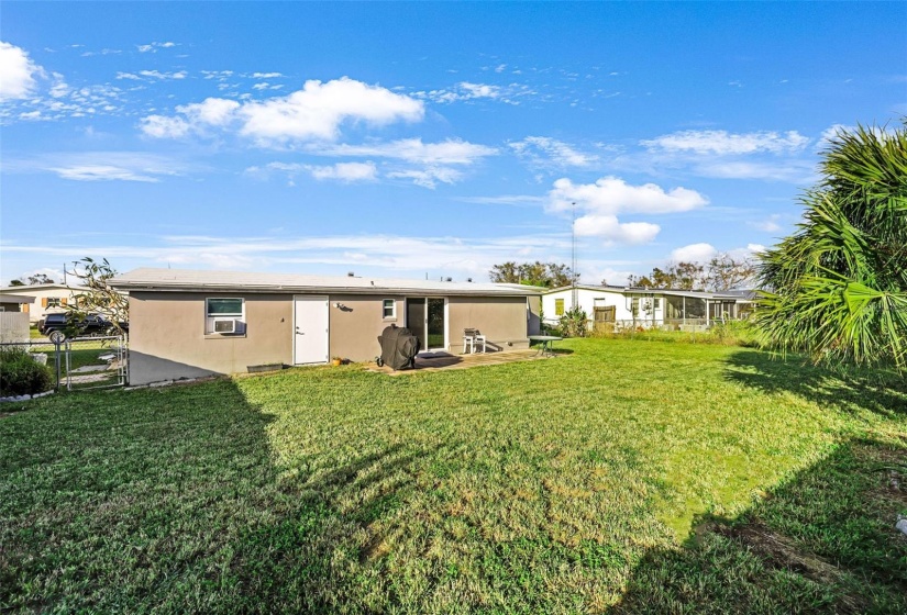 Backyard with patio and chain link fence