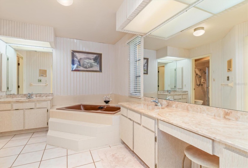 Primary ensuite bath with jetted tub and two vanities!