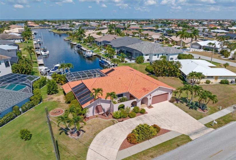 Enjoy long canal views from your lanai that includes a true extended lap pool and sauna. Plus, 58-ft of city-maintained concrete seawall / waterfront.