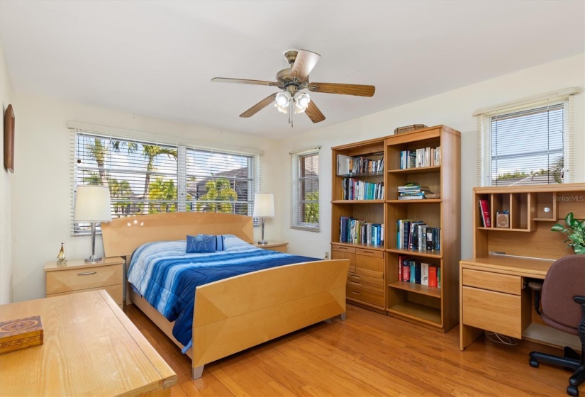 One of two guest bedrooms. This bedroom features beautiful hardwood floors and faces the canal.