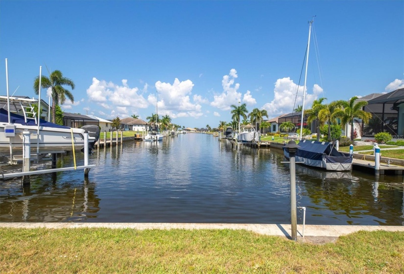 Amazing long canal views towards the Western skies. PGI skies deliver amazing sunsets that never disappoint. The 58-ft waterfront, city maintained seawall, will easily accommodate a sailboat or power boat.