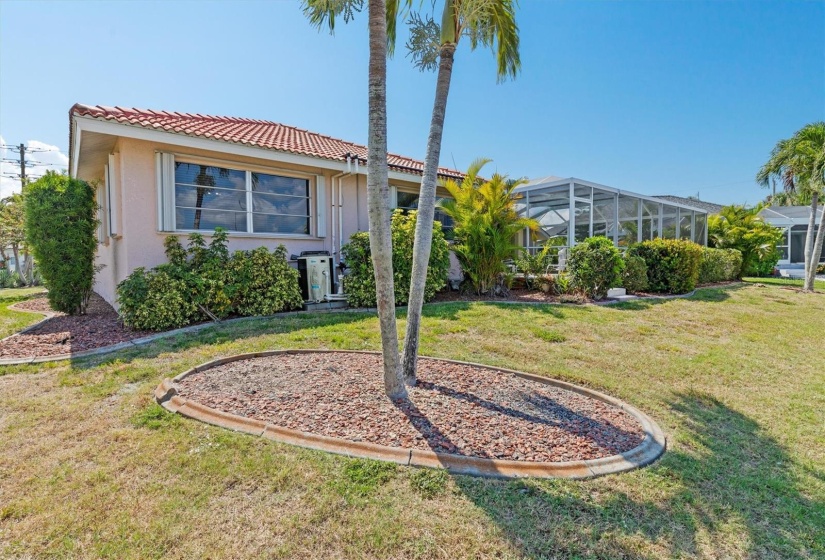 View of North side of home with mature landscaping.