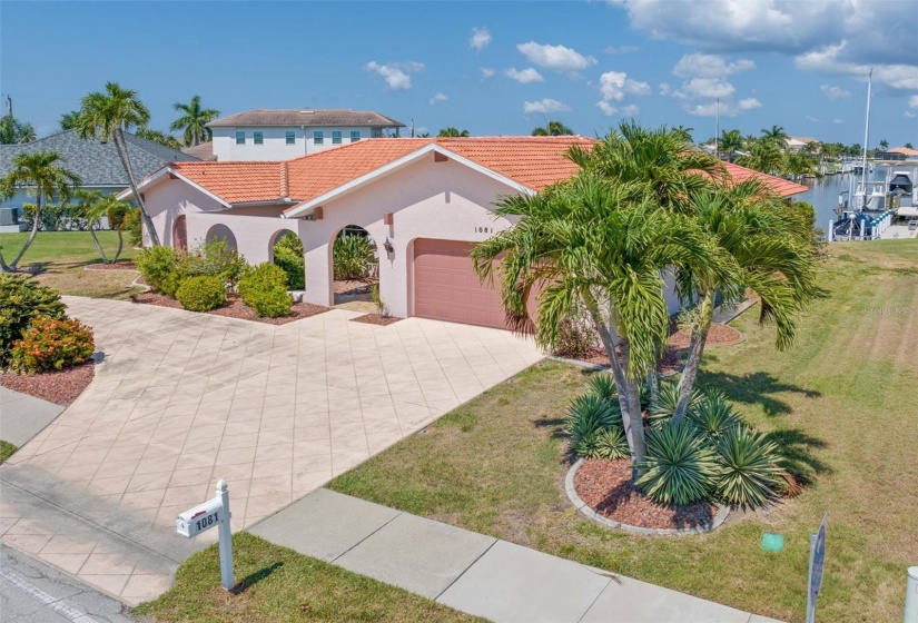 Circular drive and mature landscaping welcome you to this 2,300+ sq. ft. waterfront pool home.