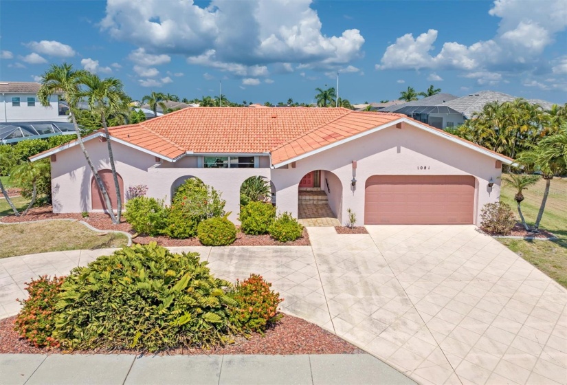 Enjoy 3 bedrooms, two full baths, pool, sauna, screened lanai and gorgeous Western views down the long canal.