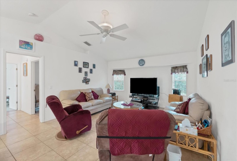 FAMILY ROOM VIEW FROM KITCHEN AS WELL AS GUEST BEDROOM SIDE OF HOME DOWN THE HALL