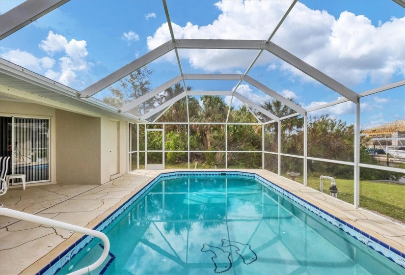 LONG VIEW OF POOL FROM 3RD BEDROOM SLIDER AREA