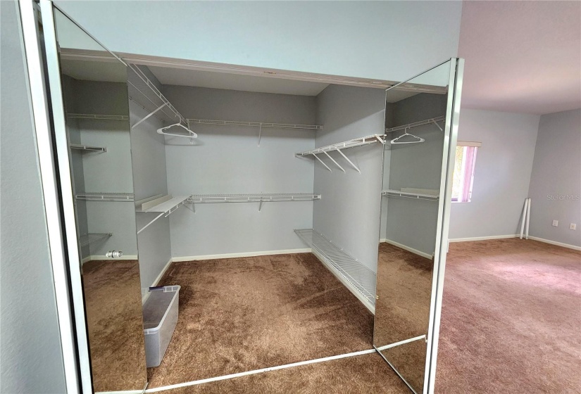 walkin closet with mirrored bifolds  7x7